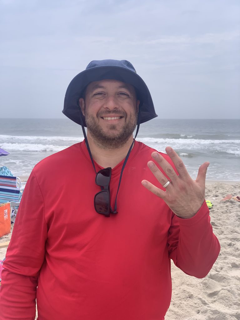 Happy customer getting ring back after being lost in the sand in Beach Haven NJ